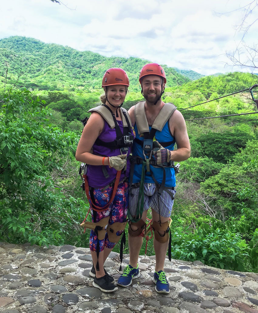 Couple in their ziplining gear for the superman zipline in Costa Rica