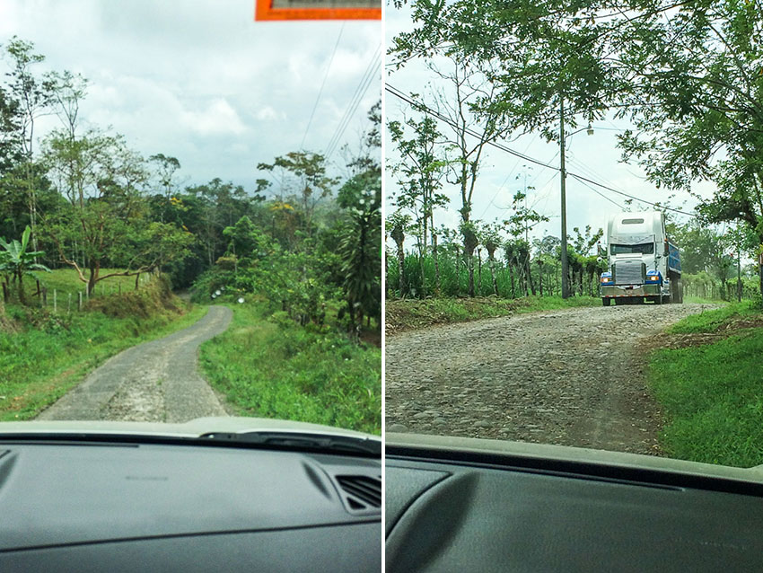 View from a car trying to share a very narrow road with a transport truck in Costa Rica