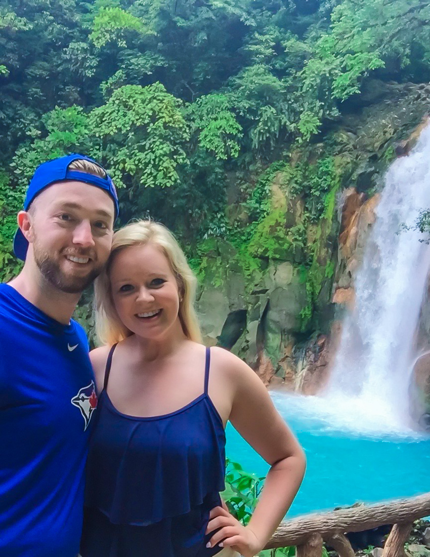 Madison and Liam in front of the Rio Celeste waterfall