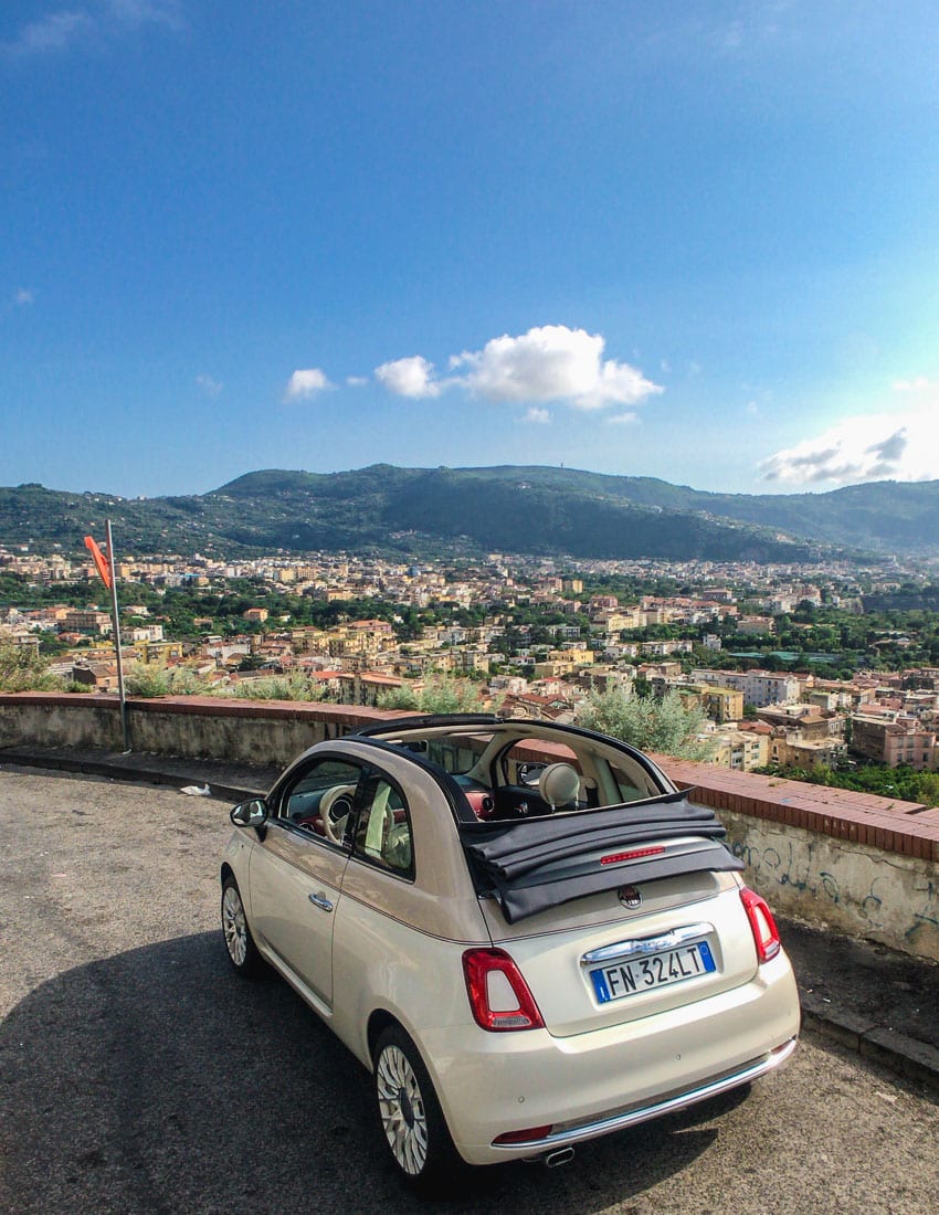 Fiat 500 with Sorrento, Italy in the backdrop