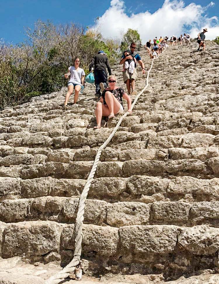 Madison climbing down the Coba ruins