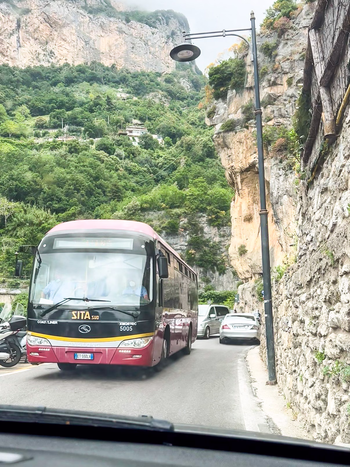 Meeting a bus on the narrow Amalfi Coast road in Italy